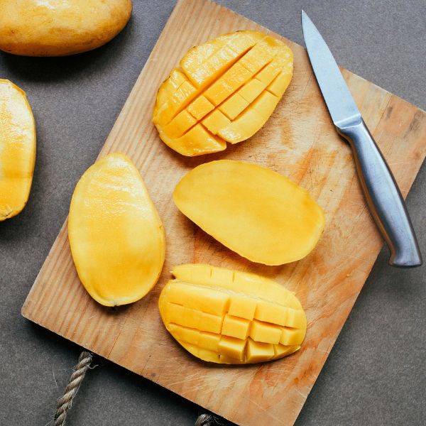 Fresh mangoes from Local Market in a 3 kg carton, showcasing ripe, yellow fruit ready for ripening or consumption.