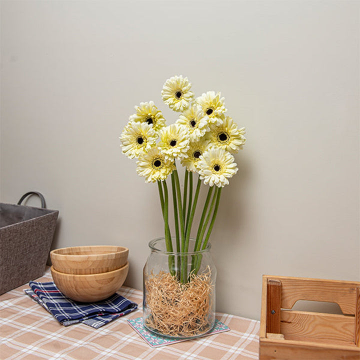 Gerbera Snow King flowers with 10 stems, vibrant white blossoms, arranged in a bouquet, by Flowranow.
