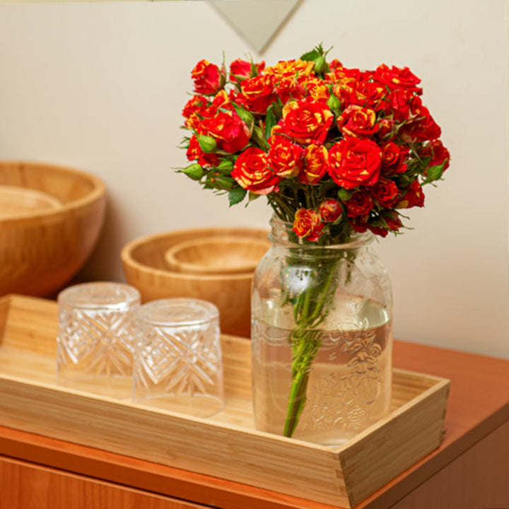 Bright red Roses Baby Fire Flash flowers on 10 stems by Black Tulip, showcasing vibrant blooms and lush green leaves.