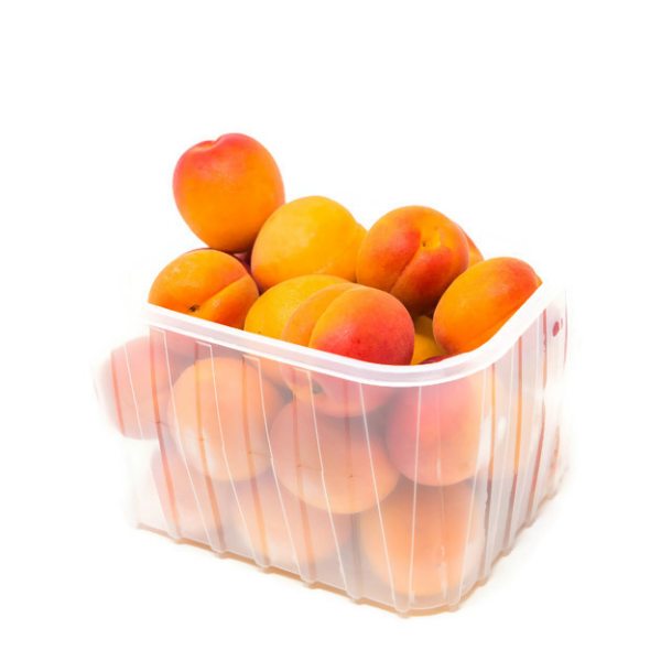 Fresh Sharbatly apricots in a 1 kg pack, showcasing ripe, orange fruit with smooth skin and vibrant color.