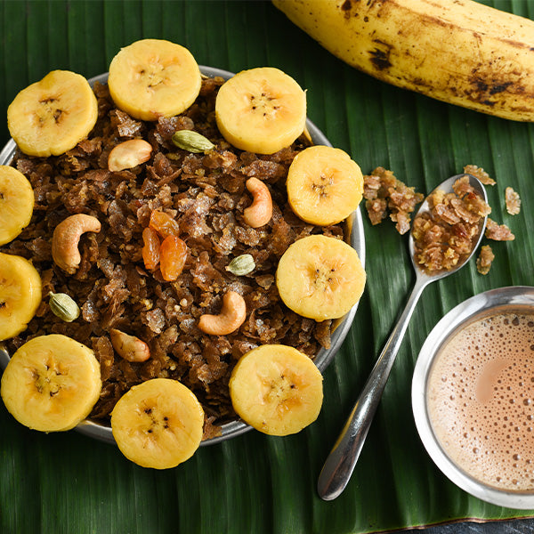 Fresh Nendran Kerala bananas from India in a 1 kg bunch, showcasing their vibrant yellow color and natural shape.