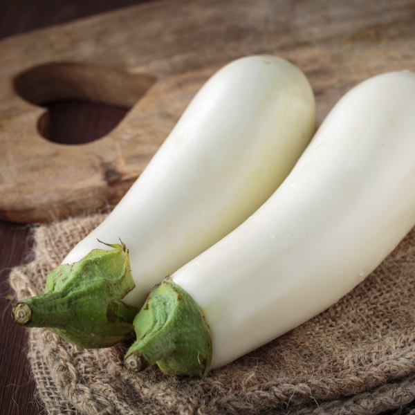 Fresh white eggplants from Local Market, 1 kg pack, showcasing smooth, shiny vegetable with green stems and vibrant appearance.